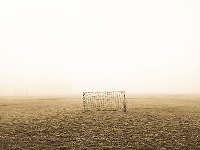 black soccer net in the middle of the desert thumbnail