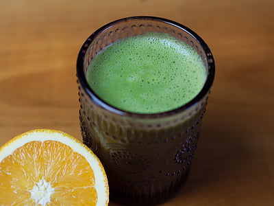 cup of matcha tea with sliced orange fruit thumbnail