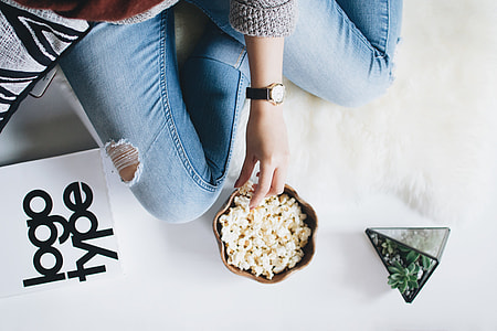 woman holding popcorn white sitting thumbnail