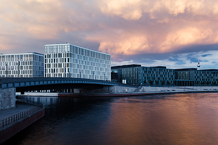 view of white buildings beside body of water thumbnail