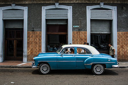 A classic car sits on an old street in Havana, Cuba. Image captured with a Canon DSLR thumbnail