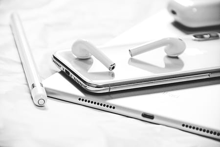 silver iPhone X with Apple Pencil and AirPods thumbnail