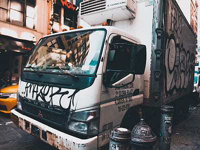 white box truck near sidewalk thumbnail