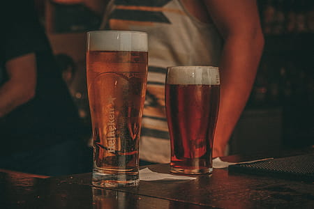 Two Clear Drinking Glass Filled With Beer thumbnail