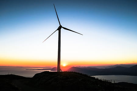 silhouette of wind turbine during sunset thumbnail