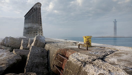 grey concrete building beside the sea thumbnail