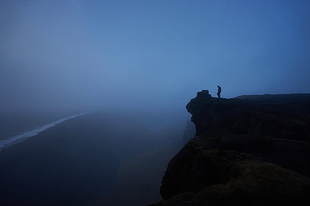 person standing on cliff thumbnail