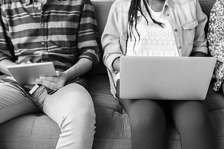 grey-scale photo of woman using laptop thumbnail