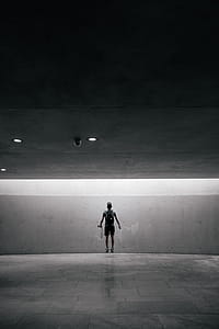 Man Jumps In Paved Room Photo thumbnail