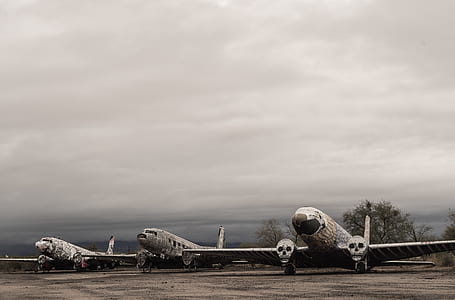 three gray-and-white airplanes thumbnail