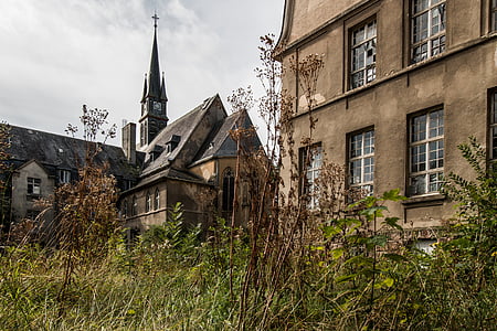 concrete buildings near green grass thumbnail