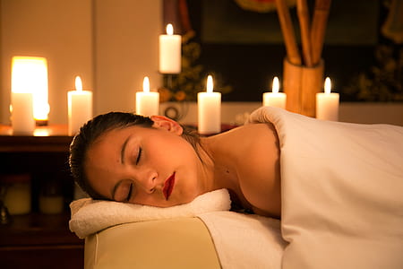 woman lying on cream bed covered with white blanket thumbnail