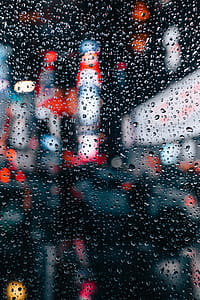 City Lights Through Rain Window Photo thumbnail