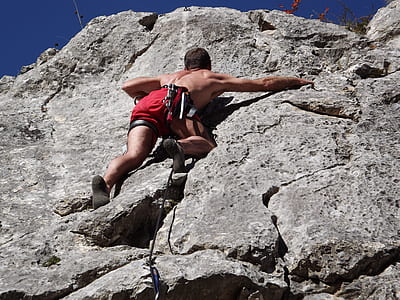 man climbing on rock thumbnail