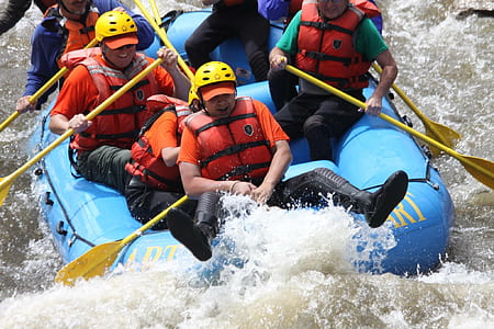 people riding boat white rafting on water stream thumbnail