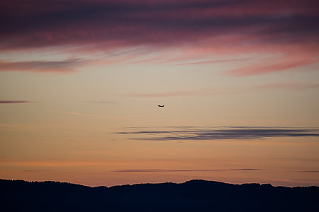 silhouette of mountain during orange sky thumbnail