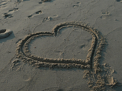 heart sand drawing during daytime thumbnail
