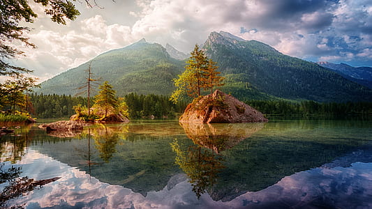 body of water with mountain in the background thumbnail