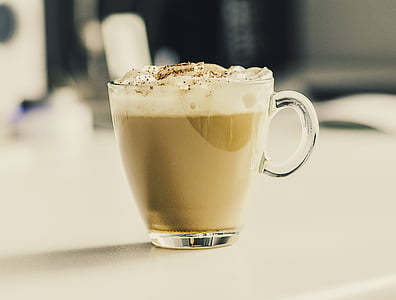 shallow focus photography of clear glass mug on top of table thumbnail