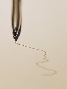macro photography of silver ballpoint pen thumbnail