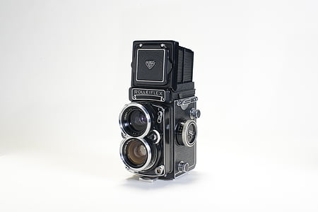 black and gray camera on white surface thumbnail