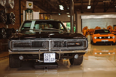 black muscle car on garage thumbnail