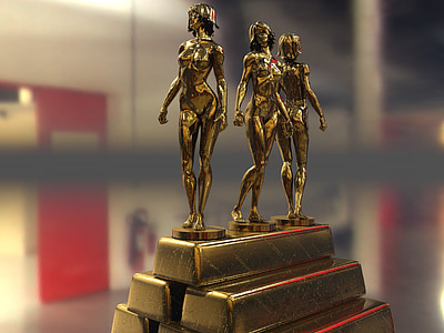 three girl figurine and gold bar close-up photo thumbnail