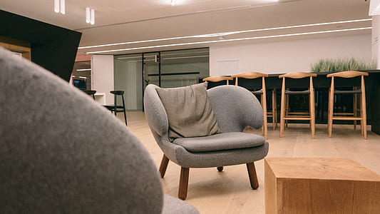 gray armchair with brown wooden base thumbnail