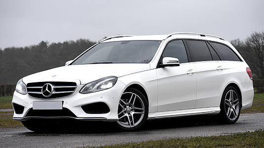 white Mercedes-Benz station wagon vehicle parked ahead thumbnail