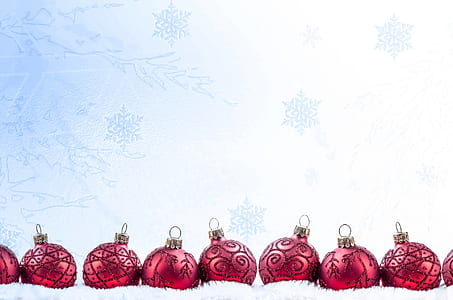 nine red baubles on white textile thumbnail