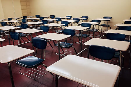white school desk with stainless steel base and blue padded armchairs thumbnail