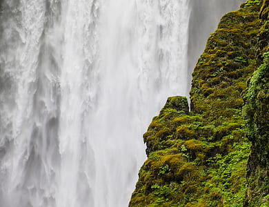 waterfalls near rock cliff thumbnail
