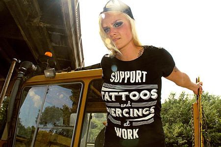 woman standing on tractor thumbnail