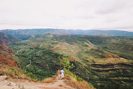 man and woman standing on mountian thumbnail