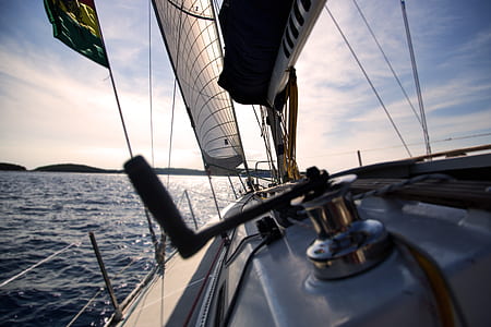 closeup photography of fishing reel in sailing boat thumbnail