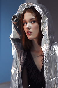 woman wearing gray hooded jacket thumbnail