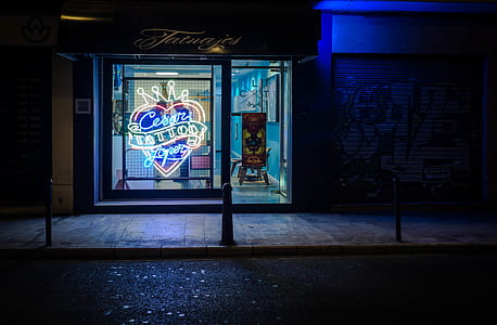 neon lighted storefront near road thumbnail