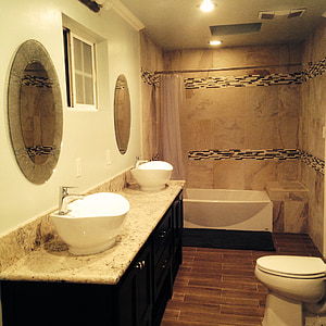 two white vessel sinks on bathroom near white flush toilet thumbnail