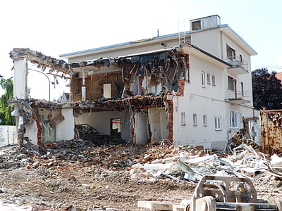 wrecked white concrete 3-storey building at daytime thumbnail