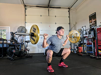 man lifting barbell inside the gym thumbnail