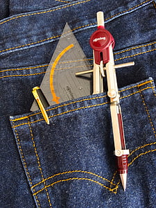 drafting compass, pen, and protractor in jeans pocket thumbnail