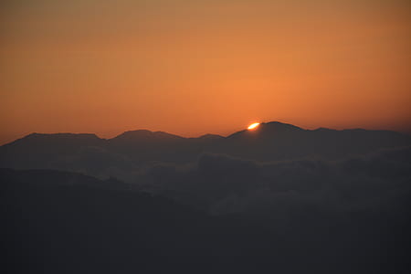 silhouette of mountain during golden hour thumbnail