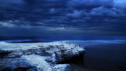 white cliff under cloudy sky thumbnail