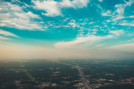 aerial view of city under blue and white sky thumbnail