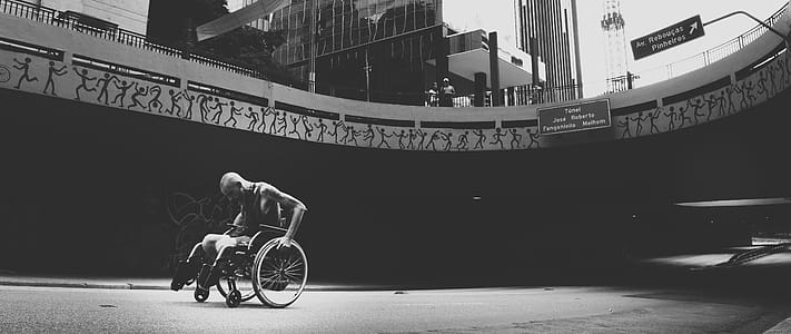 Grayscale Photo of Man on Wheelchair thumbnail