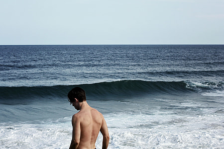 man near on seashore during daytime thumbnail