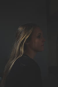 woman in black top sideview thumbnail