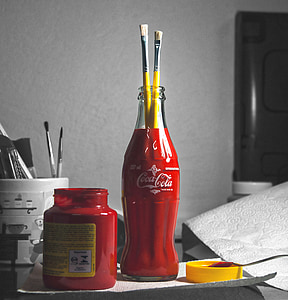 two paint brushes on Coca-Cola bottle thumbnail