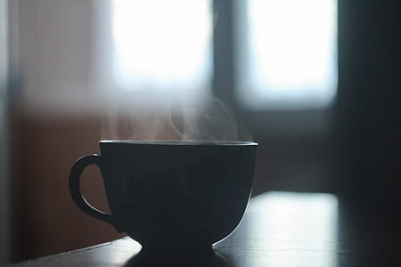 ceramic mug on brown table thumbnail