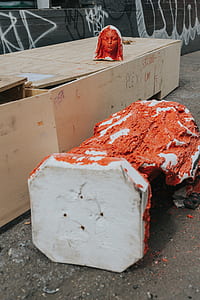 red and white statue of woman thumbnail